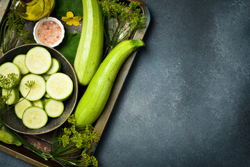 Naklejka na ściany i meble A bowl of sliced zucchini ready for cooking. Close-up. Top view.