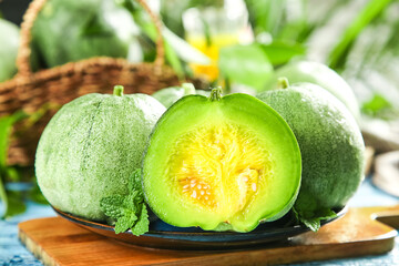 Fresh Shandong Emerald Melons Cut Half Yellow Flesh Seeds Wooden Board Wicker Basket Background