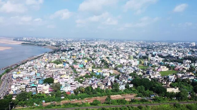 Indian city aerial view near a river. Lots of indian houses are established for high population. 
