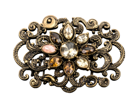 Ornate gold brooch with sparkling gemstone center on a dark background