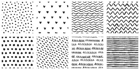 Hand-drawn ink pattern collection with brush-painted seamless abstract backgrounds in black and white. Black specks, waves, zigzags, stripes, hearts, polka dots, spotted patterns.