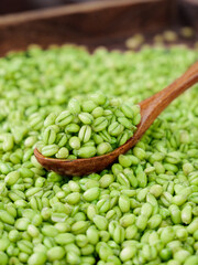 Fresh Green Wheat Kernels in Wooden Spoon - Healthy Whole Grain Cereal from Farm Harvest