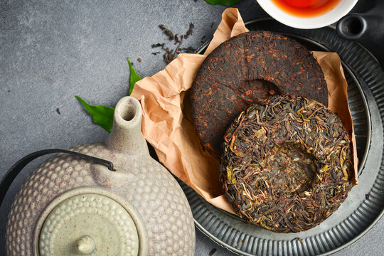 Tea ceremony. Pressed fermented Pu-erh tea, preparation for making tea.