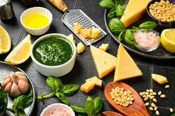 Homemade traditional pesto sauce and ingredients. Top view.