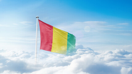 Guinea national flag waving in the sky. Guinea national flag for independence day.