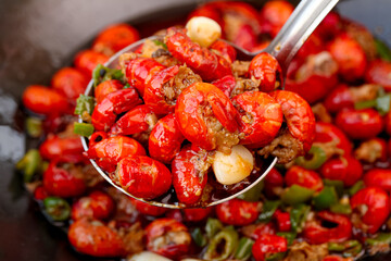 Fresh Cooked Crawfish with Garlic Seasoning on Ladle - Traditional Louisiana Seafood Dish