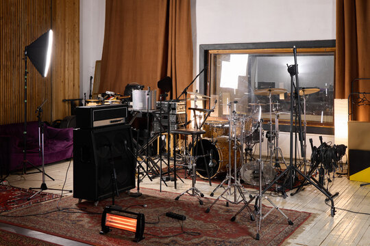 Recording studio setup with instruments and lighting for music session