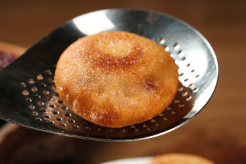 Deep Fried Sweet Rice Cake on Metal Strainer - Traditional Asian Handmade Dessert