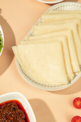 Handmade Corn Tortillas in Basket with Salsa for Authentic Mexican Tacos Cooking