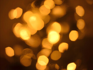 Fototapeta premium Warm golden bokeh lights creating a cozy and magical atmosphere for festive celebrations or romantic moments
