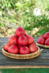 Fresh Red Pears in Wicker Baskets on Wooden Table - Organic Fruit Display