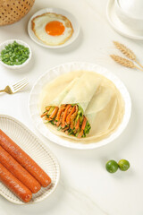 Handmade Pancake Wrap with Shredded Pork and Vegetables Healthy Breakfast Meal Setup