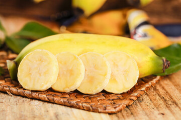 Small Emperor Bananas from Guangxi Hainan China Sliced Fresh Tropical Fruit on Wooden Basket
