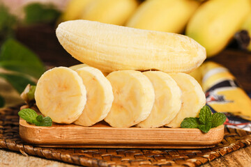 Fresh Sliced Bananas on Wooden Board with Mint Leaves - Healthy Tropical Fruit