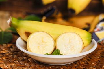 Fresh Hainan Emperor Bananas Sliced on Plate - Sweet Tropical Fruit Display with Mint Garnish