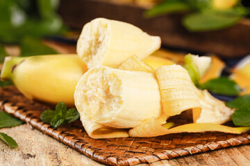 Fresh Sweet Hainan Emperor Bananas Sliced on Bamboo Mat - Tropical Fruit Photography