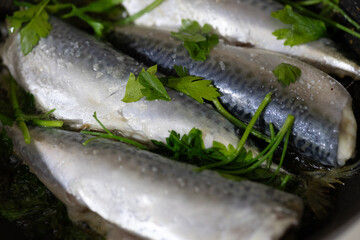Close-Up of Fish Cooked with Parsley in a Pan
