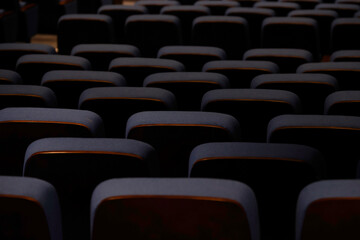 Karachi, Pakistan - April 10, 2025: A captivating view of multiple rows of empty seats under dim...