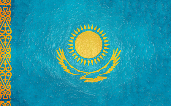 Flag of kazakhstan waving in the wind with golden sun, eagle and ornament