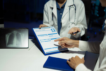 patient filling insurance legal document at appointment with doctor. patient signing medical treatment contract, agreement form for taking medic care service, consultation, therapy.