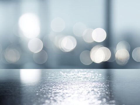 Sparkling lights reflecting on glass desk top in modern office festive professional environment