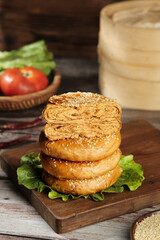 Traditional Chinese Layered Pastry with Sesame Seeds Beijing Style Dessert on Wooden Board