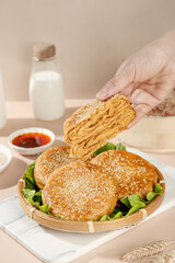 Traditional Chinese Sesame Seed Biscuits with Hand Presentation and Dipping Sauce