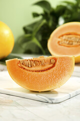 Fresh Honeydew Melon Slice on Marble Board - Healthy Summer Fruit Snack with Orange Flesh