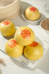 Traditional Chinese Handmade Steamed Buns with Red Fortune Symbols and Bamboo Steamer