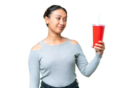 Young Uruguayan woman holding soda over isolated chroma key background with happy expression