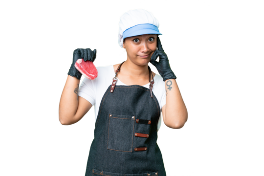 Butcher woman wearing an apron and serving fresh cut meat over isolated chroma key background having doubts - Powered by Adobe
