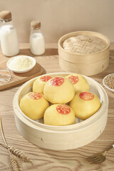 Handmade Chinese Steamed Buns with Fortune Characters in Bamboo Steamer - Traditional Shandong Cuisine