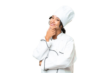 Young chef Argentinian woman over isolated background smiling