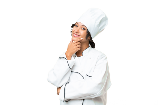 Young chef Argentinian woman over isolated background smiling - Powered by Adobe