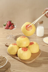 Handmade Chinese Steamed Buns with Fortune Stamps - Traditional Shandong Layer Buns on Wooden Board