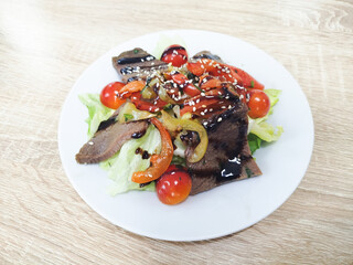 Savory beef salad with fresh vegetables and sauce