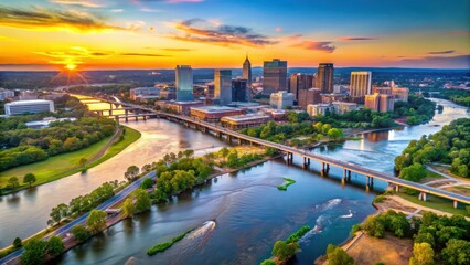 Fototapeta premium Aerial view of Richmond cityscape at sunset with the James River flowing through it