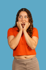 Young woman feeling anxiety and biting her nails