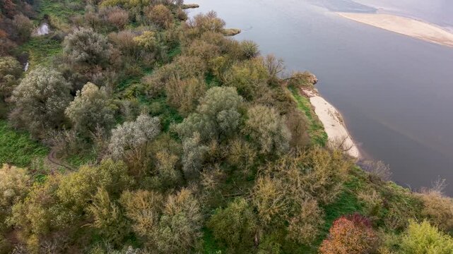 Aerial Vistula River forest farms north Poland 1. Forests with rural farm agriculture farm landscape. Historic and economic basis of eastern Europe. Autumn fall colors. Rich agricultural heritage.