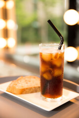 Iced Americano and bread enjoyed at a cafe