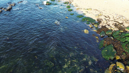 View of coast with stone and blue sea