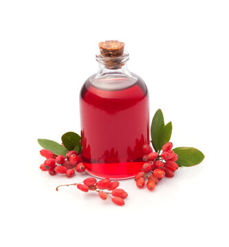 Barberry syrup in bottle and berberine berries