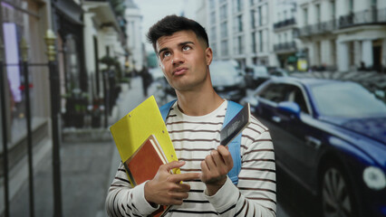 Man standing on city street holding canadian passport and pointing with a thoughtful expression, surrounded by buildings and cars, suggesting travel contemplation.