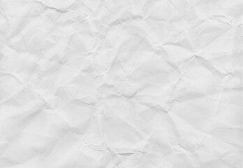 Crumpled white paper texture with soft shadows, ideal for backgrounds or design elements