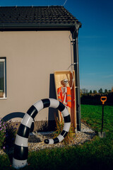 Halloween background. Halloween skeleton for decorated house. Scary decorated front yard of American house. Caricature or something. Halloween background. Autumn holiday of Halloween.