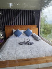 Place the bed against the glass wall to provide a view.