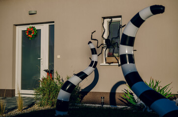 Halloween background. Halloween skeleton for decorated house. Scary decorated front yard of American house. Caricature or something. Halloween background. Autumn holiday of Halloween.