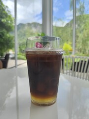 Cup of Ice black coffee on the table