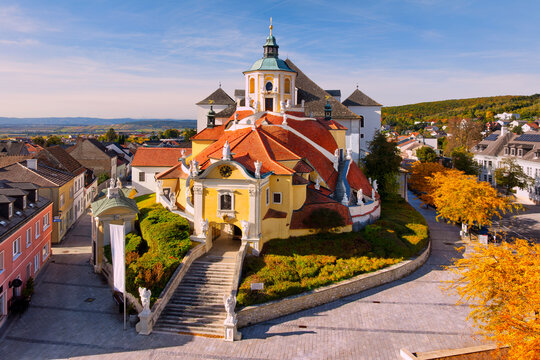 Fototapeta Aerial view of the beautiful Bergkirche (or Haydnkirche) in the capital of Burgenland (Austria) - Eisenstadt on an autumn morning