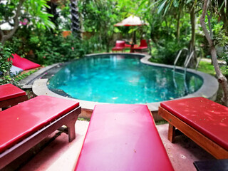 Swimming pool in the middle of the hotel area, with blurry background